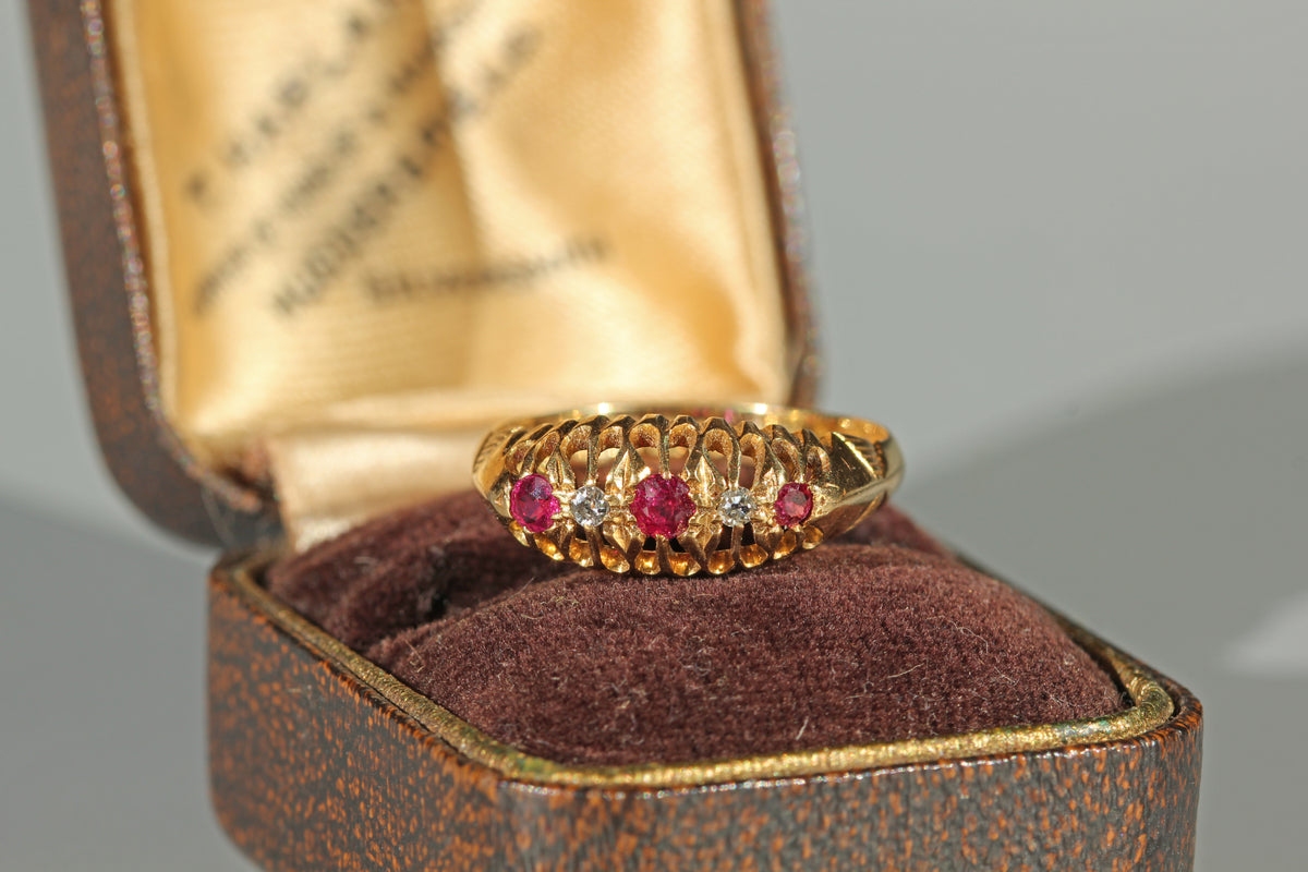 Antique 18ct gold old cut diamond and ruby boat ring, photographed in an antique ring box