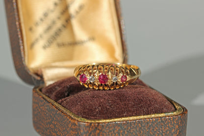 Antique 18ct gold old cut diamond and ruby boat ring, photographed in an antique ring box