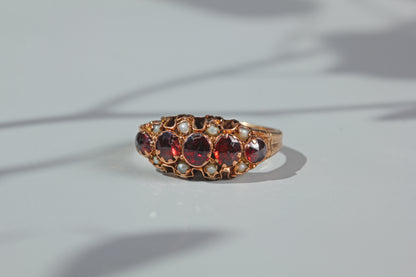 close up of antique half hoop ring with garnets