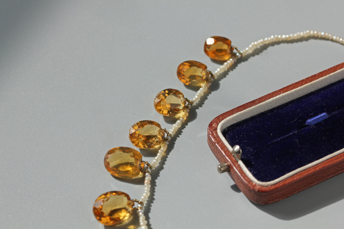 Antique Victorian faceted citrine stones suspended off a pearl necklace