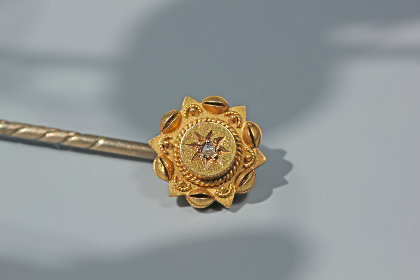 Close up of antique 15ct gold diamond stick pin