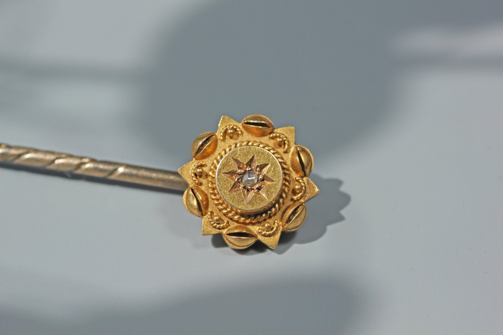 Close up of antique 15ct gold diamond stick pin