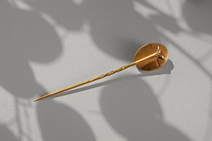 back view of a Victorian pearl and blue enamel stick pin
