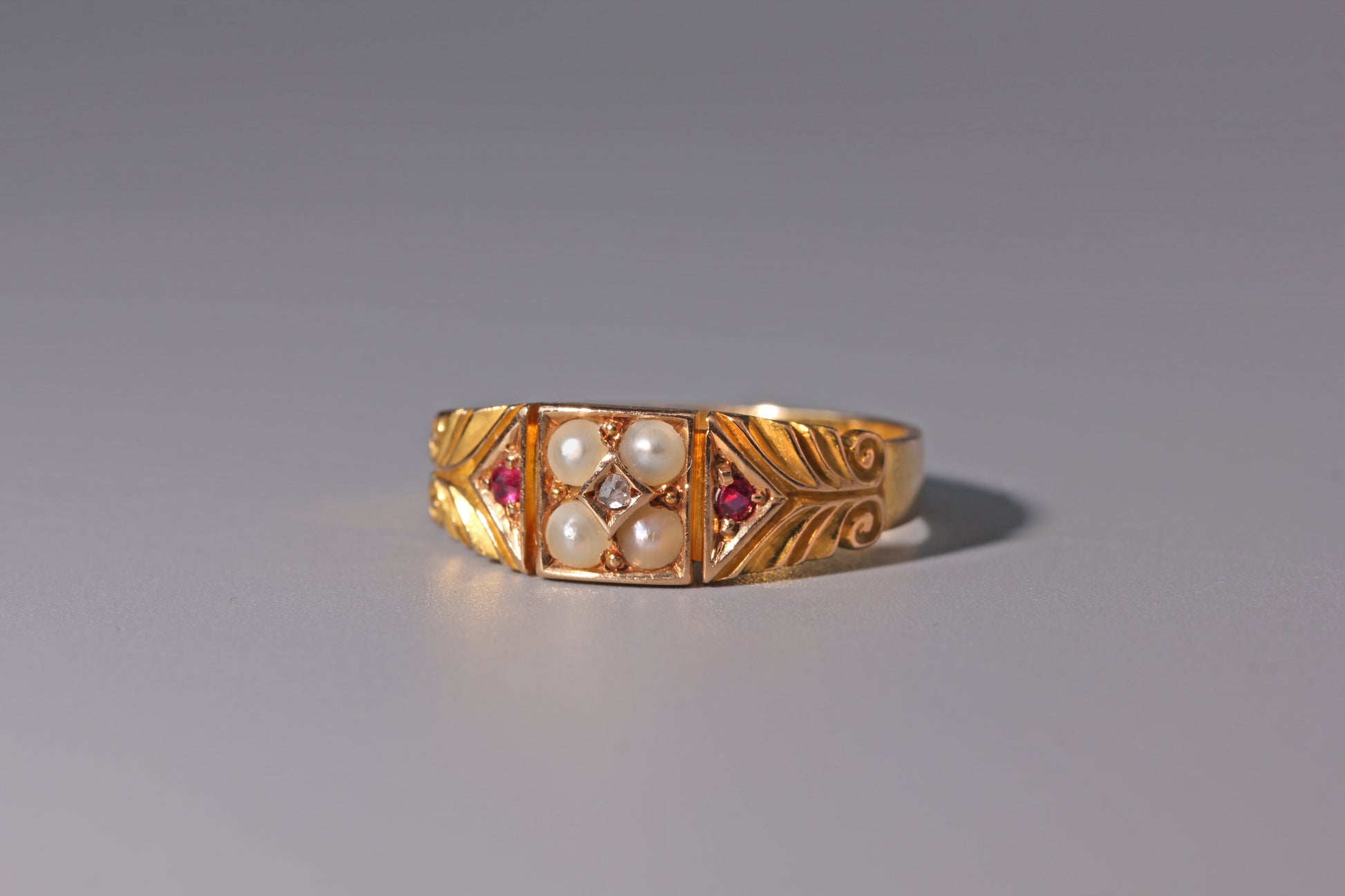 Antique engagement ring with pearls and diamonds