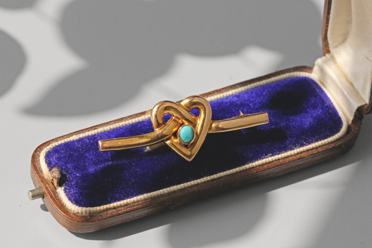 Antique turquoise heart brooch in 9 carat gold displayed on velvet jewellery box