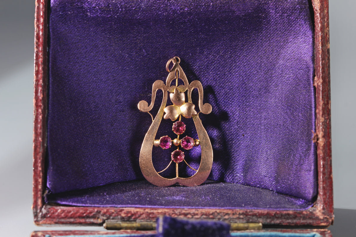 An antique 9ct gold pink tourmaline art nouveau pendant