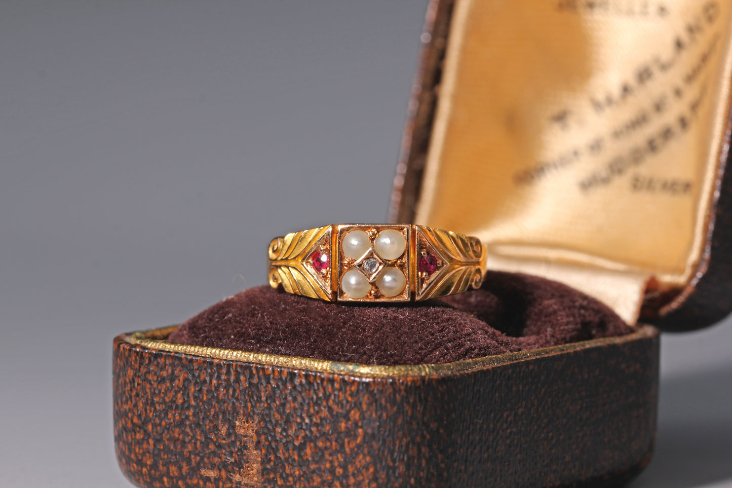 Victorian gold ring with rubies, diamonds and seed pearls in 15ct gold