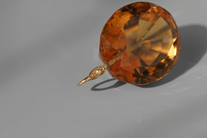 close up of a 9ct seed pearl bail loop on an antique faceted citrine stone