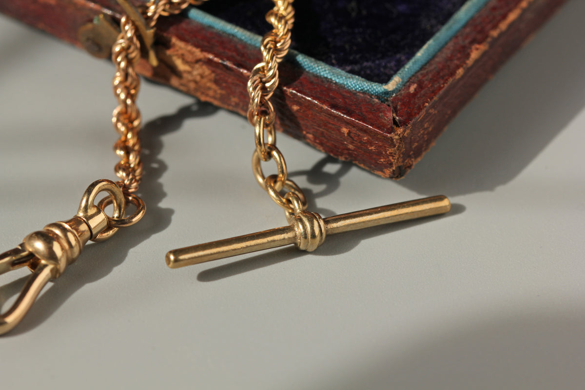 close up of antique 9ct gold bar on watch chain