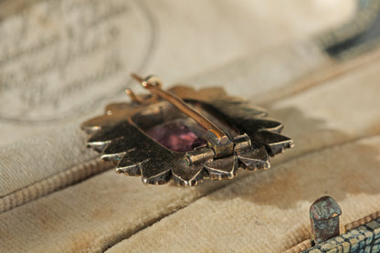 Antique tube hinge fastening on brooch in a beige lined antique jewellery box 