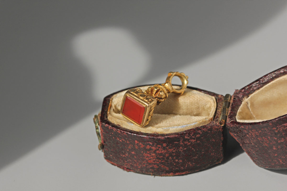 Antique Victorian carnelian seal fob in 9ct gold, displayed in antique ring box