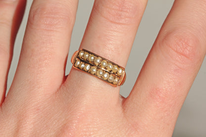 Antique pearl band ring with engraved shoulders detail on finger