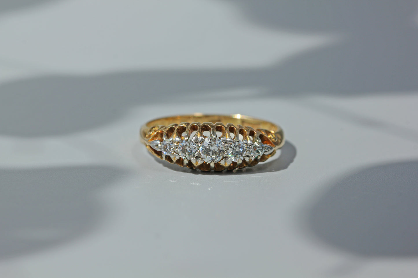 Antique art deco wedding band, studded with five diamonds and crafted in 18ct gold