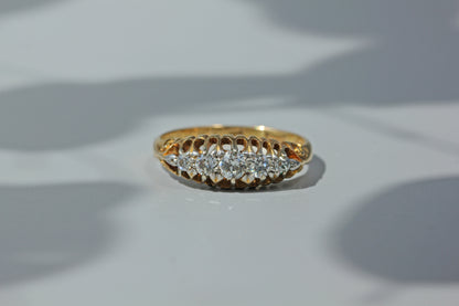 Antique art deco wedding band, studded with five diamonds and crafted in 18ct gold