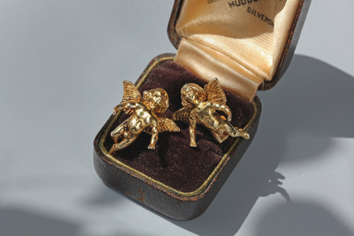 Vintage sterling silver gilt angel stud earrings with detailed wings
