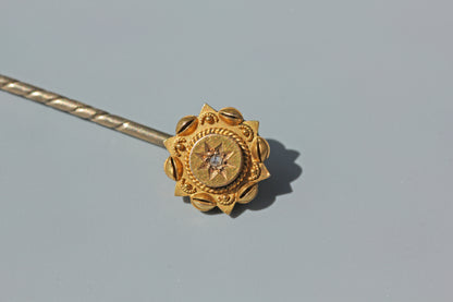 Detailed front view of a Victorian 15ct gold diamond stick pin
