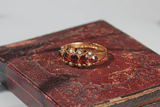 Victorian garnet and pearl five stone ring with engraved shoulders
