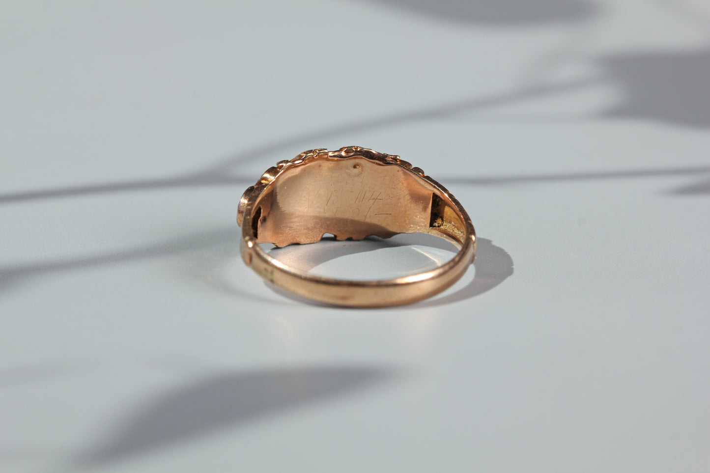 Interior view of antique garnet ring setting and band
