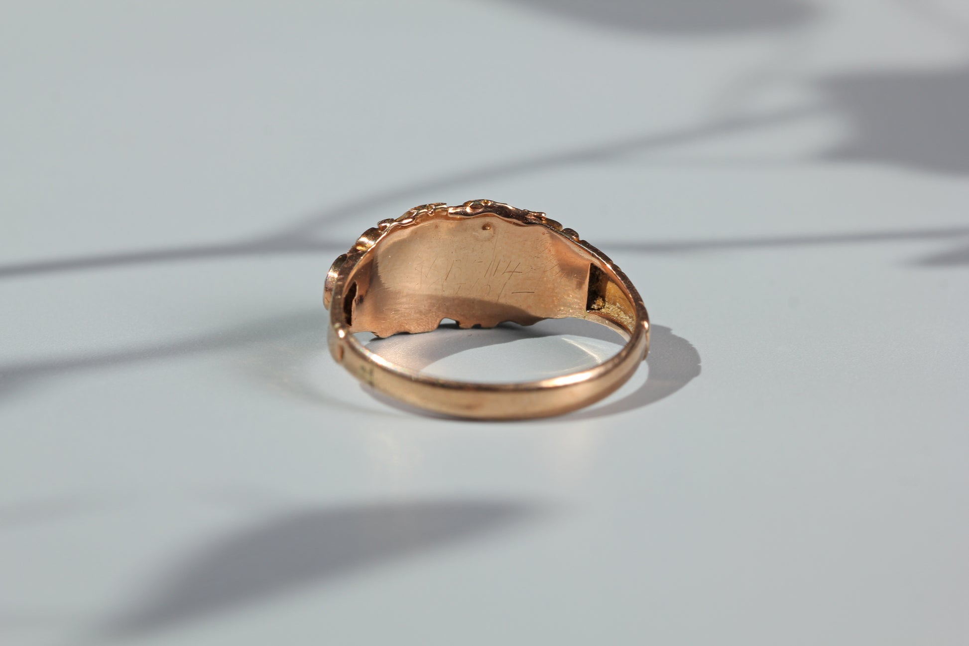 Interior view of antique garnet ring setting and band
