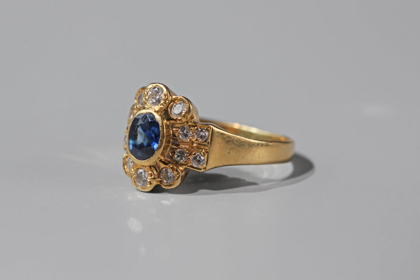 Side profile of a vintage 18ct gold sapphire and diamond ring
