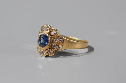 Side profile of a vintage 18ct gold sapphire and diamond ring