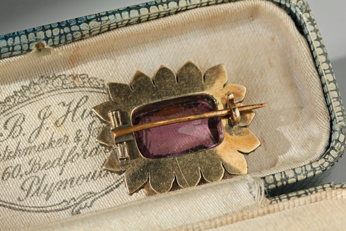Antique brooch clasp details, with a tube hinge and c-catch closure on a 9ct gold frame, displayed in an antique jewellery 