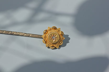Close view showing the construction of an antique Victorian gold stick pin
