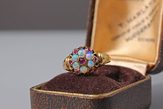 Antique gold cluster ring with opals and amethysts on antique jewellery box