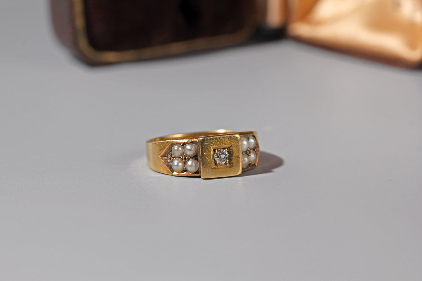 Antique Victorian signet style ring with old cut diamond and pearl cluster shoulders
