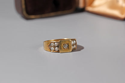 Antique Victorian signet style ring with old cut diamond and pearl cluster shoulders
