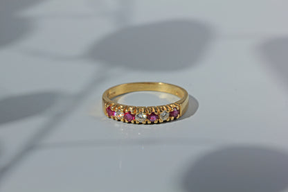Front view of 18ct ruby and diamond wedding band, crafted in 18ct gold