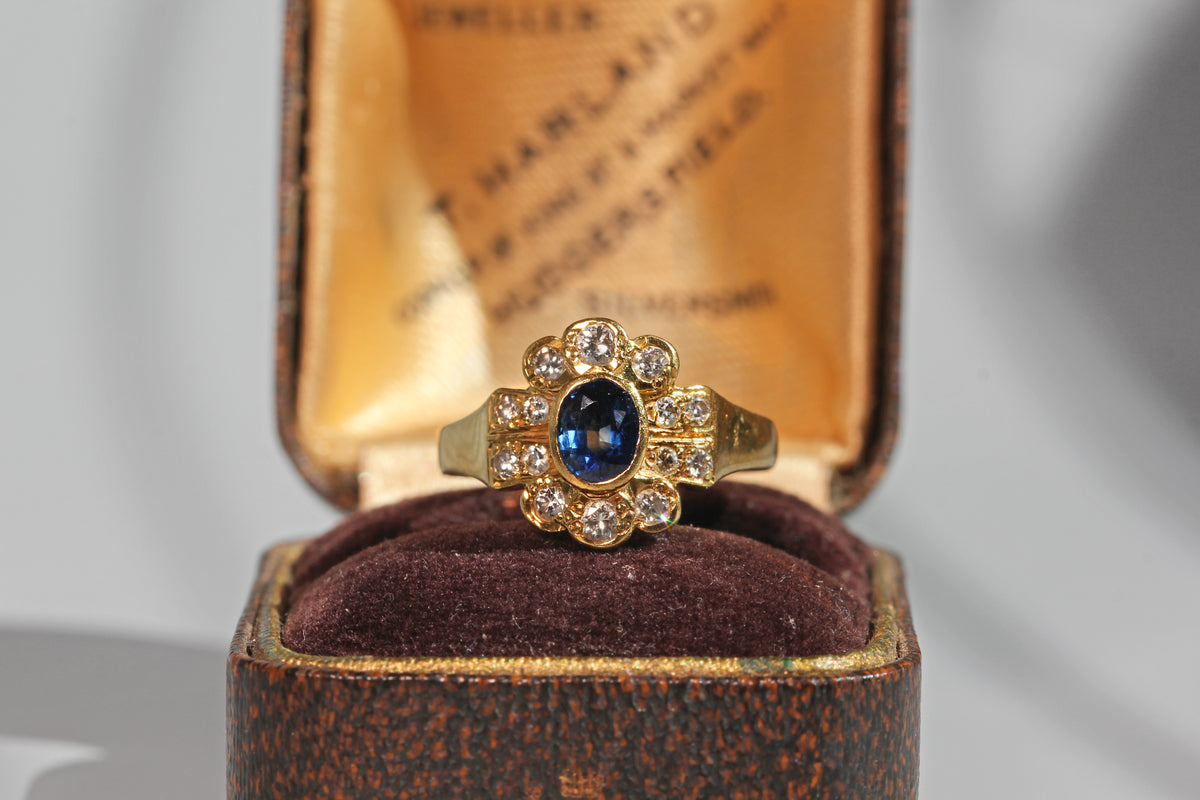 Vintage sapphire and diamond cluster ring in 18ct gold in antique ring box