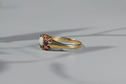 side profile of vintage gold ruby and opal ring