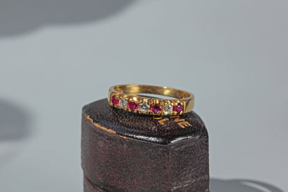 Vintage ruby and diamond half eternity band ring in 18ct gold on antique ring box