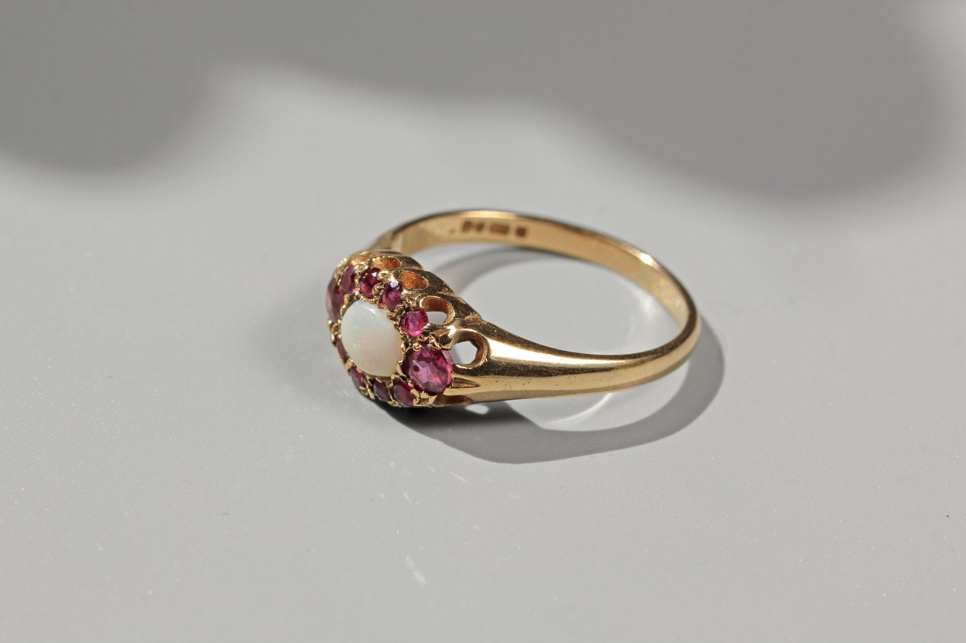 vintage engagement ring with rubies and opal