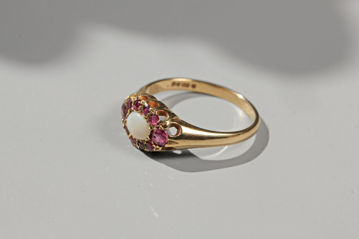 vintage engagement ring with rubies and opal