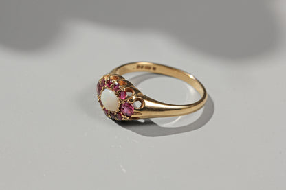 vintage engagement ring with rubies and opal